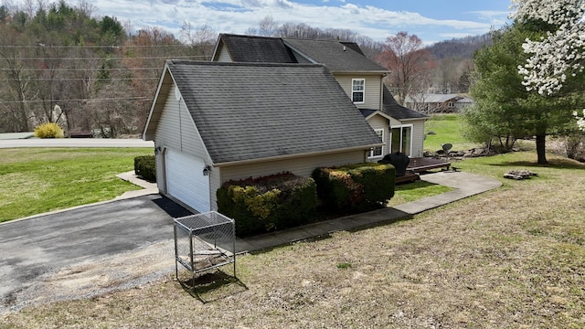 35 Fox Trail Rd, Manchester, KY 40962 - view of side of home with driveway, roof with shingles, a garage, and a yard