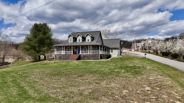 35 Fox Trail Rd, Manchester, KY 40962 - farmhouse with driveway, a porch, and a front yard