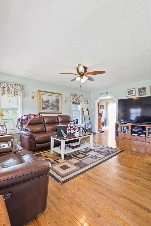 35 Fox Trail Rd, Manchester, KY 40962 - living area featuring arched walkways, a textured ceiling, a ceiling fan, and hardwood / wood-style flooring