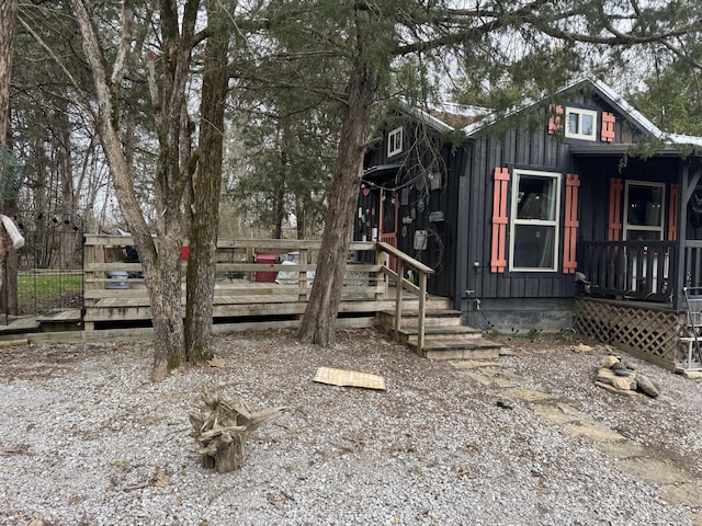 exterior space with a wooden deck and board and batten siding