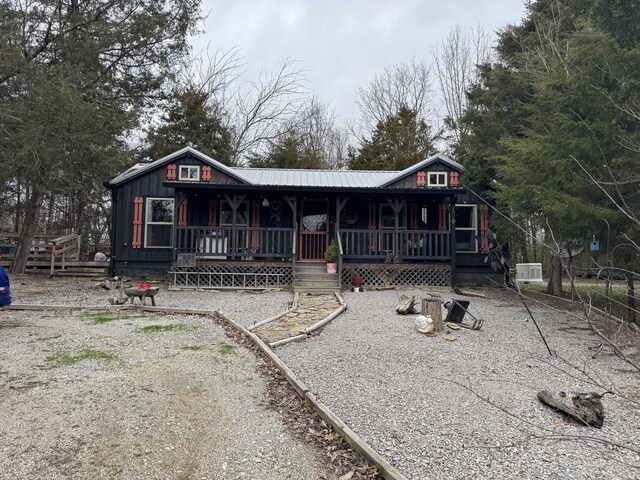 rustic home featuring covered porch