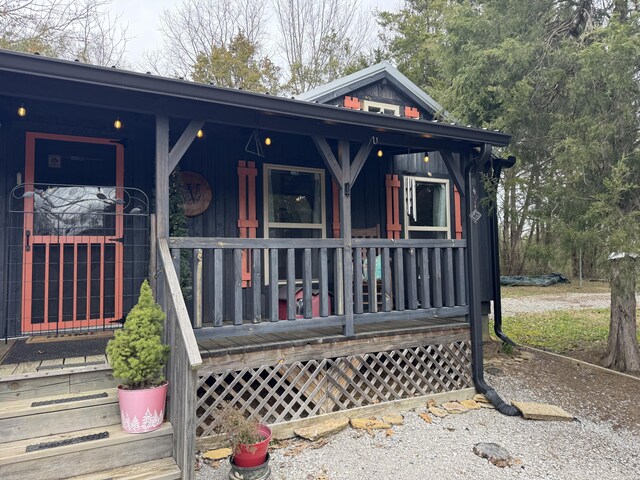 view of front facade featuring covered porch and board and batten siding