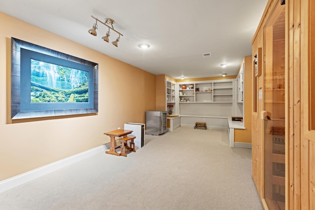 basement featuring carpet floors and baseboards