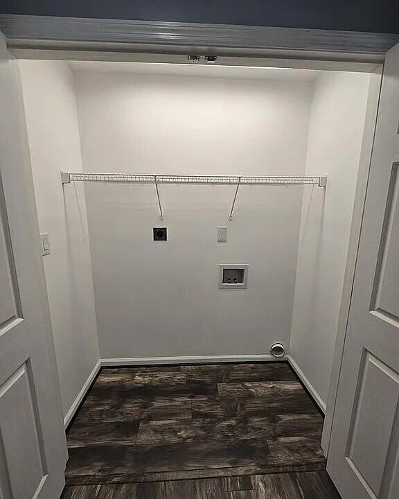 laundry area with dark wood finished floors, hookup for an electric dryer, laundry area, and hookup for a washing machine