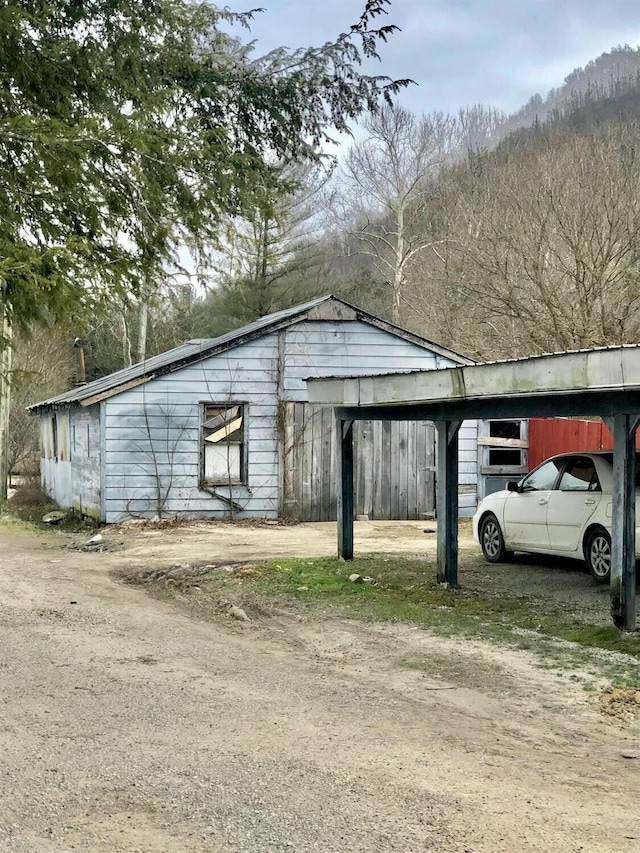 34 Owens Rd S, Clearfield, KY 40313 - view of outdoor structure with a carport and dirt driveway