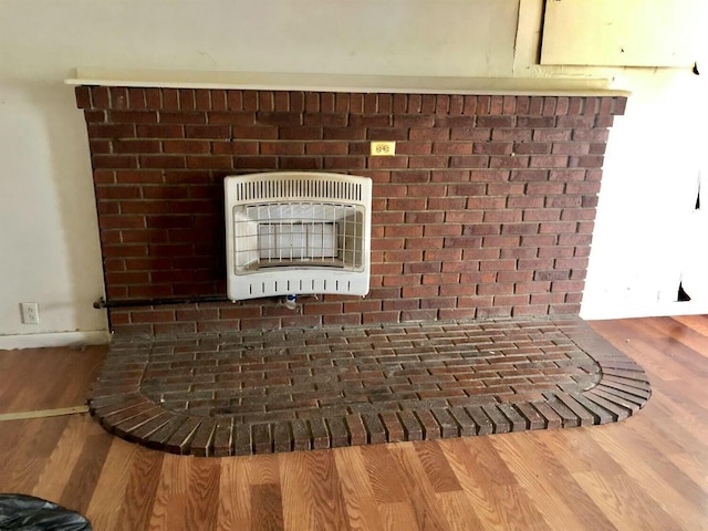 34 Owens Rd S, Clearfield, KY 40313 - interior details featuring heating unit and wood finished floors