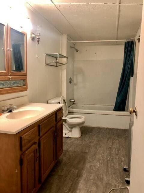 34 Owens Rd S, Clearfield, KY 40313 - bathroom with shower / bath combo, toilet, vanity, and wood finished floors