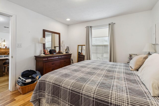 bedroom featuring light wood-style flooring and recessed lighting