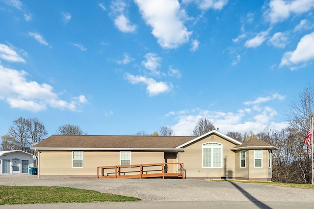 view of front of house featuring crawl space and a deck
