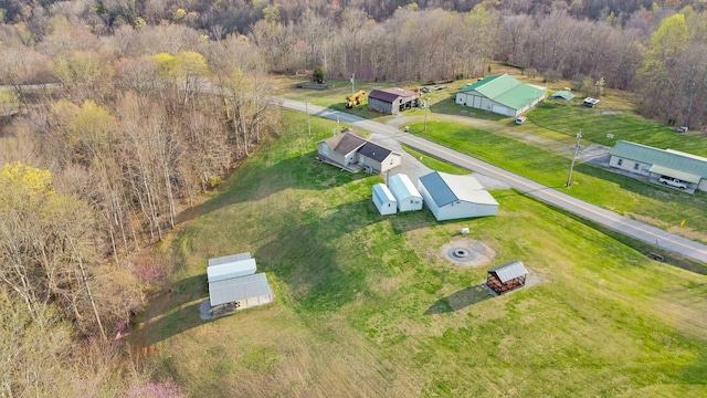 drone / aerial view featuring a forest view