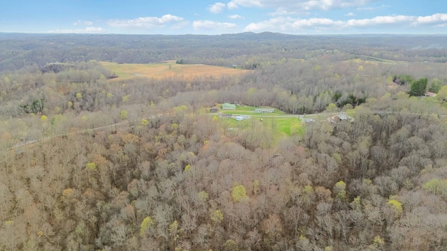 birds eye view of property with a wooded view