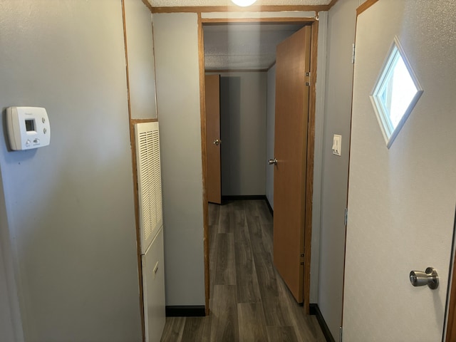 hallway with wood finished floors
