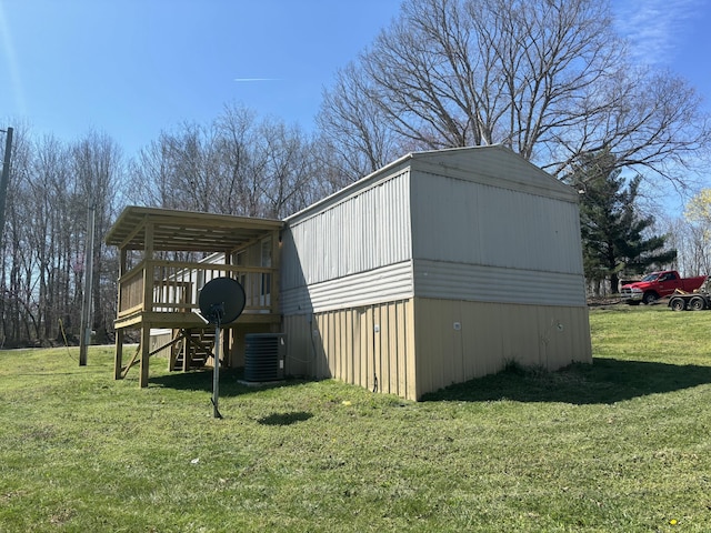 view of outdoor structure featuring central AC unit