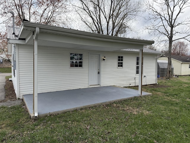 exterior space with a patio and a yard
