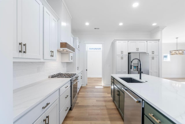 kitchen featuring backsplash, appliances with stainless steel finishes, white cabinetry, and recessed lighting