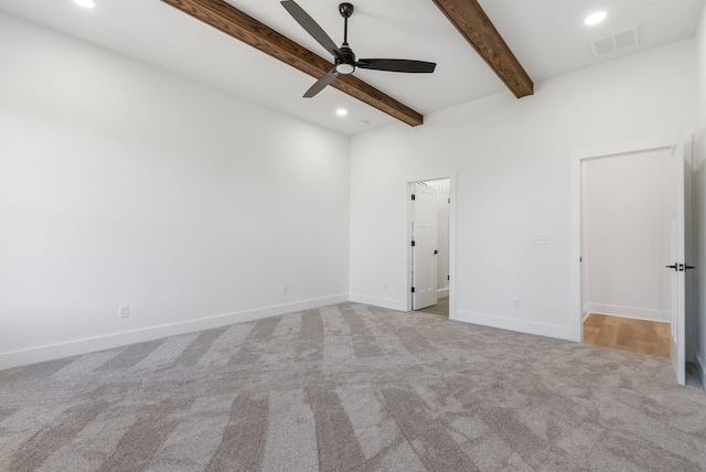 unfurnished bedroom with visible vents, recessed lighting, beam ceiling, and carpet