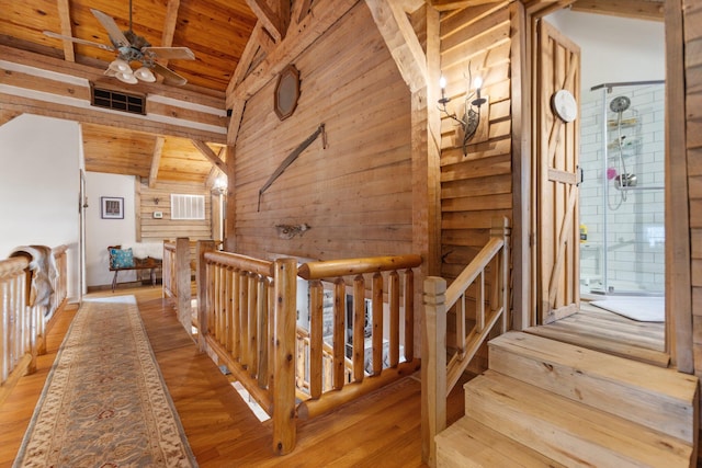 1295 Burger Knob Rd, Junction City, KY 40440 - hallway featuring an upstairs landing, wood ceiling, vaulted ceiling with beams, wooden walls, and visible vents