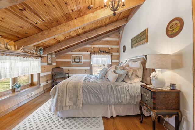 1295 Burger Knob Rd, Junction City, KY 40440 - bedroom featuring wood ceiling, a chandelier, vaulted ceiling with beams, wooden walls, and wood finished floors