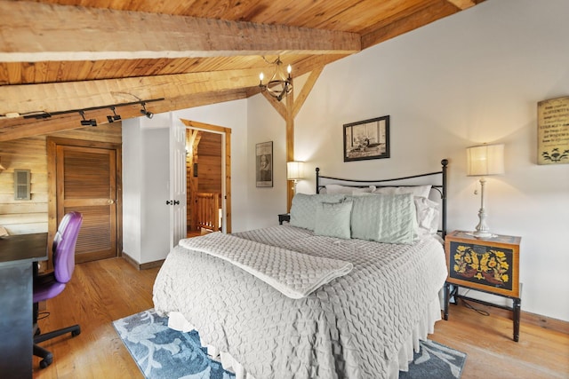 1295 Burger Knob Rd, Junction City, KY 40440 - bedroom with vaulted ceiling with beams, wood finished floors, wood ceiling, and baseboards