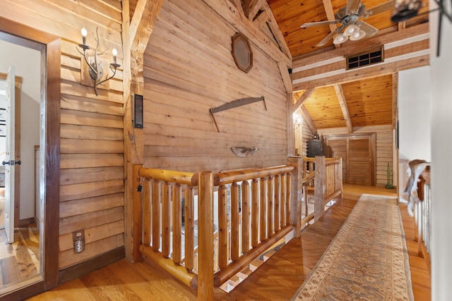 1295 Burger Knob Rd, Junction City, KY 40440 - hallway featuring vaulted ceiling, an upstairs landing, wood ceiling, wood finished floors, and wood walls