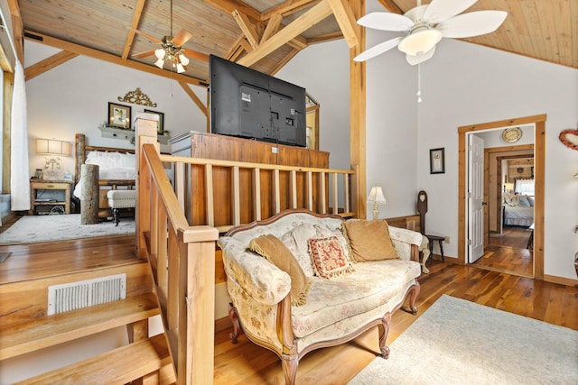 1295 Burger Knob Rd, Junction City, KY 40440 - living area featuring hardwood / wood-style floors, baseboards, wood ceiling, beamed ceiling, and ceiling fan