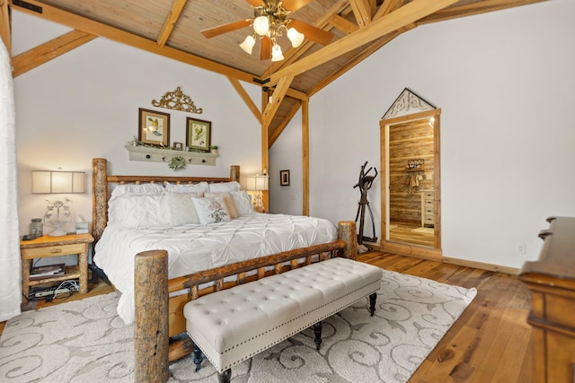 1295 Burger Knob Rd, Junction City, KY 40440 - bedroom with baseboards, ensuite bath, vaulted ceiling with beams, and hardwood / wood-style flooring
