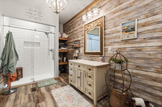 1295 Burger Knob Rd, Junction City, KY 40440 - bathroom featuring vanity, a stall shower, visible vents, a notable chandelier, and wood finished floors