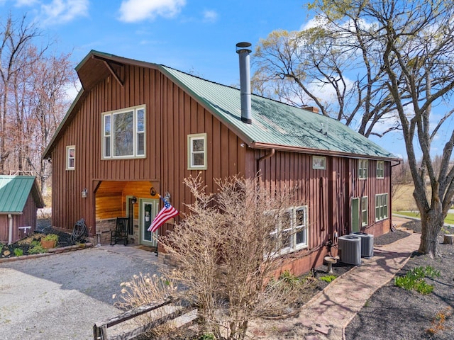 1295 Burger Knob Rd, Junction City, KY 40440 - exterior space with board and batten siding, central AC unit, and metal roof