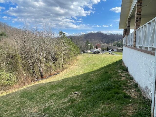 view of yard with a forest view