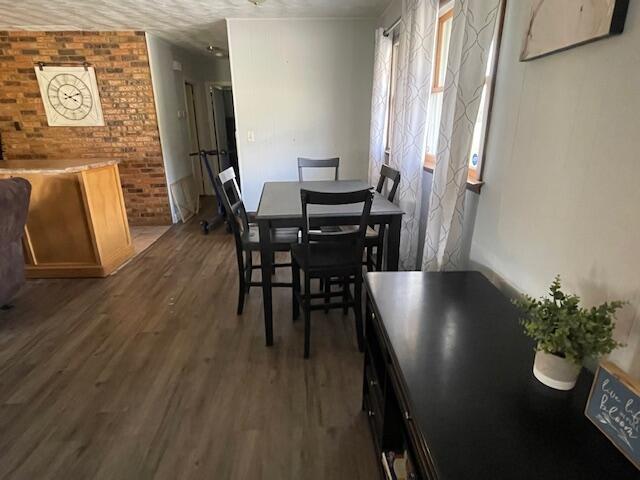 dining area with wood finished floors