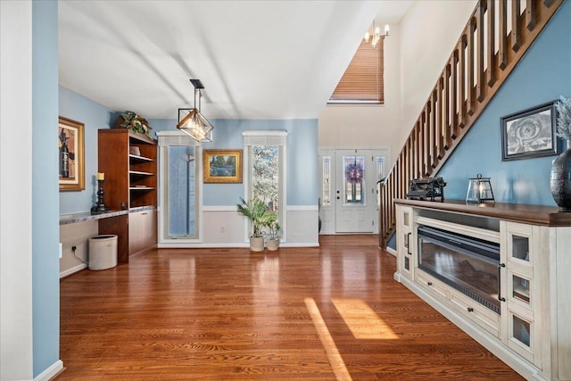 interior space featuring wood finished floors and stairs