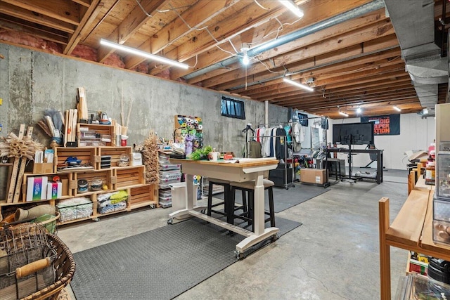 unfinished below grade area featuring a workshop area