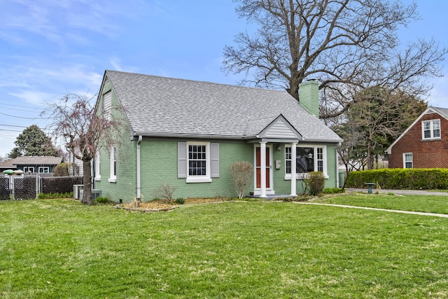 bungalow-style house featuring a front lawn, a shingled roof, fence, and a chimney
