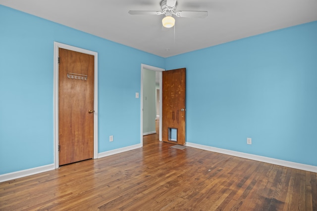 unfurnished bedroom with baseboards, wood finished floors, and a ceiling fan