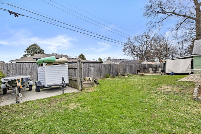 view of yard with a patio and a fenced backyard