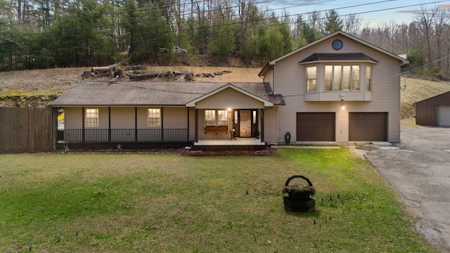 9485 US-60, Morehead, KY 40351 - view of front of house with fence, driveway, a front lawn, covered porch, and a garage