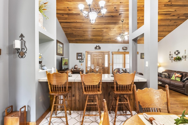9485 US-60, Morehead, KY 40351 - dining space featuring wood finished floors, high vaulted ceiling, wooden ceiling, and a chandelier