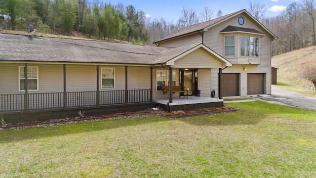 9485 US-60, Morehead, KY 40351 - view of front of property featuring aphalt driveway, a front yard, covered porch, a garage, and a shingled roof