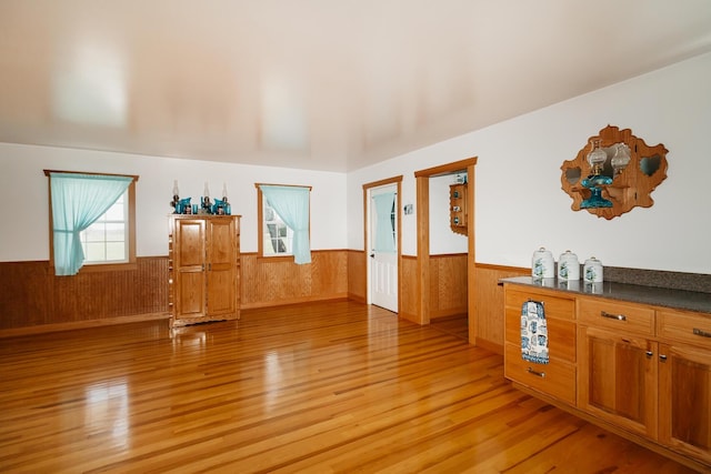 4241 Kendall Springs Rd, Owingsville, KY 40360 - interior space featuring light wood finished floors, wooden walls, and a wainscoted wall