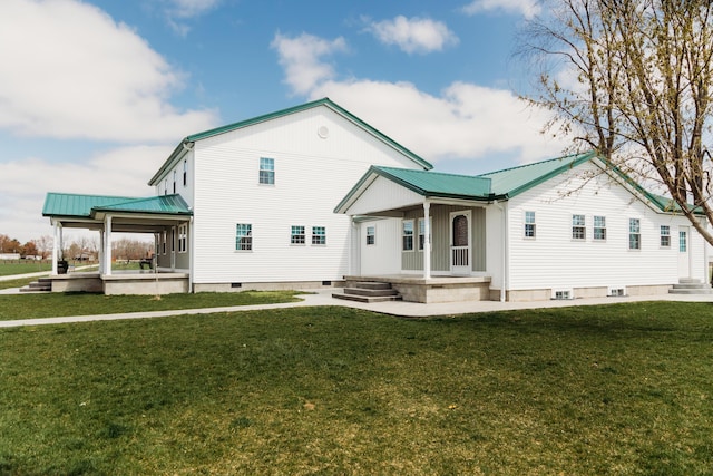 4241 Kendall Springs Rd, Owingsville, KY 40360 - rear view of property featuring metal roof, crawl space, a lawn, and covered porch