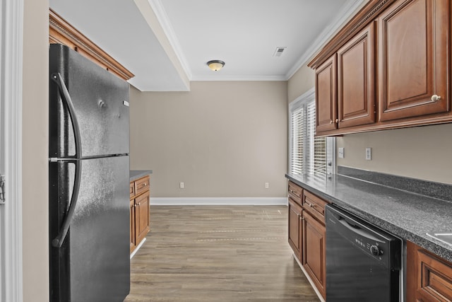209 Old Todds Rd Unit 9103, Lexington, KY 40504 - kitchen featuring crown molding, light wood finished floors, dark countertops, visible vents, and black appliances