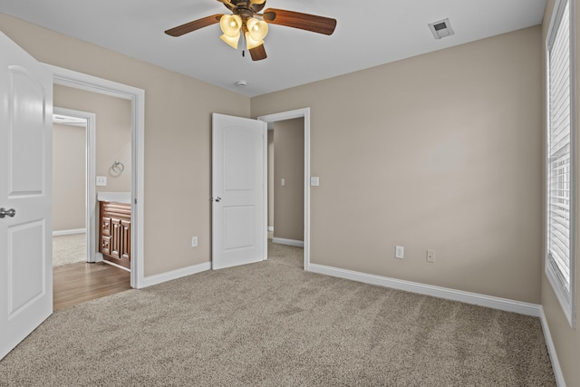 209 Old Todds Rd Unit 9103, Lexington, KY 40504 - unfurnished bedroom featuring baseboards, carpet floors, visible vents, and a ceiling fan