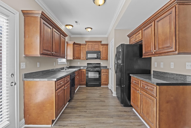 209 Old Todds Rd Unit 9103, Lexington, KY 40504 - kitchen featuring visible vents, black appliances, dark countertops, and ornamental molding