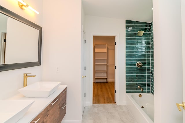 948 Meadow Ln, Lexington, KY 40505 - bathroom with a spacious closet, double vanity, a sink, and shower / bathtub combination