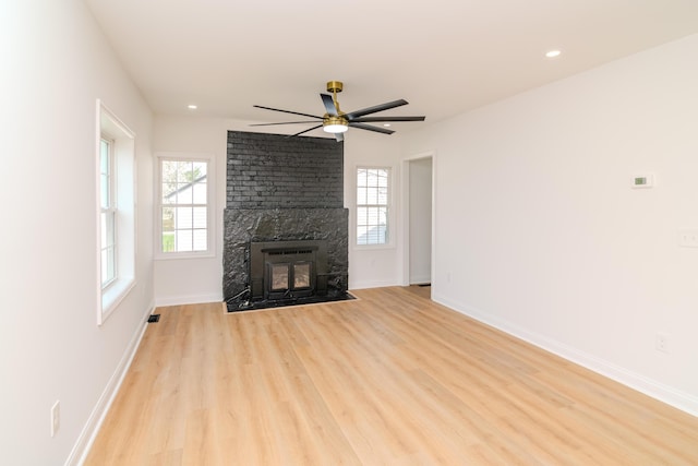 948 Meadow Ln, Lexington, KY 40505 - unfurnished living room with light wood-style flooring, a brick fireplace, baseboards, recessed lighting, and a ceiling fan