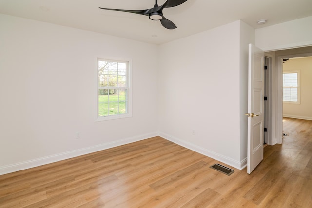 948 Meadow Ln, Lexington, KY 40505 - empty room featuring baseboards, light wood-type flooring, ceiling fan, and a healthy amount of sunlight