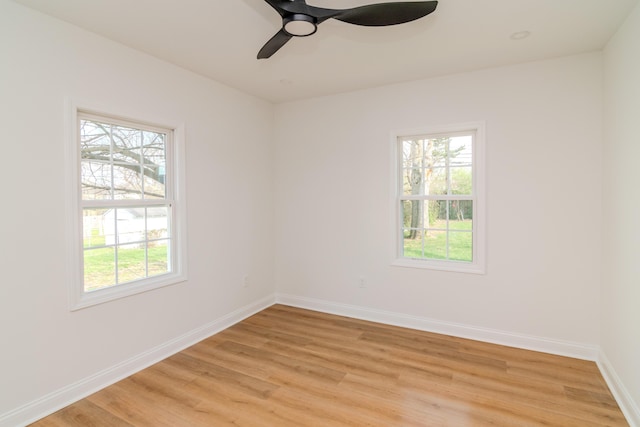 948 Meadow Ln, Lexington, KY 40505 - empty room with baseboards, a healthy amount of sunlight, light wood-style floors, and a ceiling fan