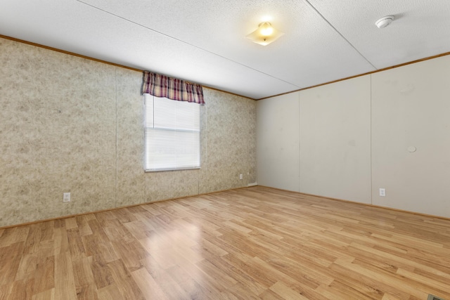 2190 Bluebank Rd, Morehead, KY 40351 - empty room featuring wood finished floors, ornamental molding, and a textured ceiling