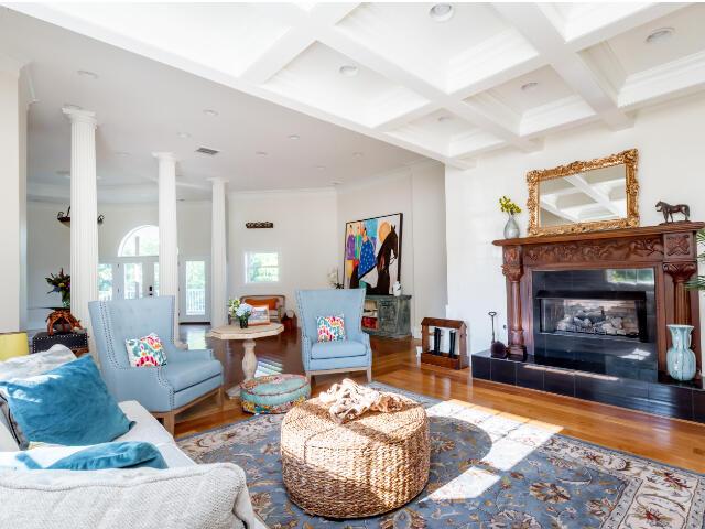 4950 Jennie Kate Ln, Lexington, KY 40510 - living room featuring wood finished floors, coffered ceiling, decorative columns, and beam ceiling