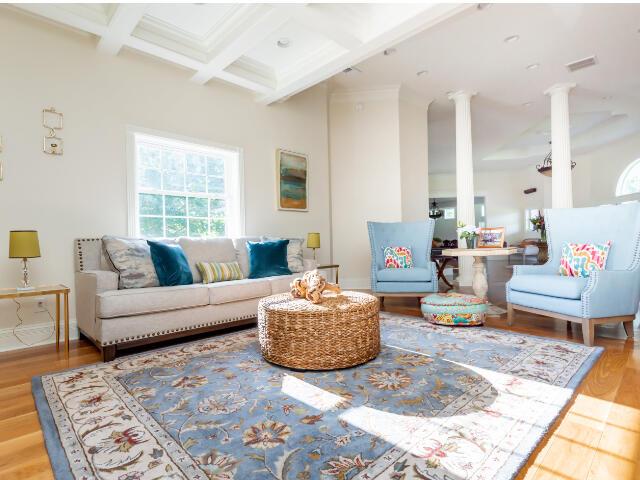 4950 Jennie Kate Ln, Lexington, KY 40510 - living area with wood finished floors, coffered ceiling, decorative columns, and beam ceiling